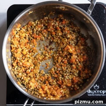 Classic Italian Lentils with Garlic and Rosemary 6 Dry lentils added to sauce pan and combined.