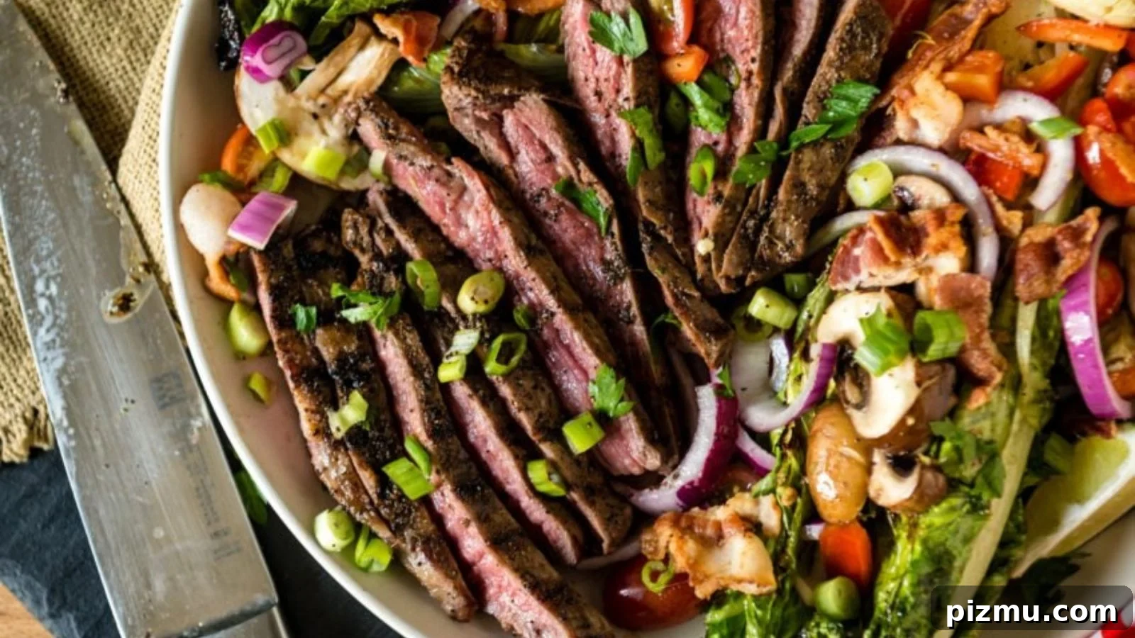 Steak salad crusted with coffee rub grilled and sliced over greens.