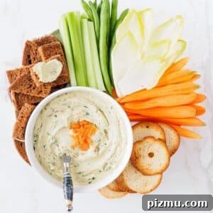 Smoked Salmon and Cream Cheese Dip Recipe 6 Platter with bowl of smoked salmon dip surrounded with veggies and crackers.