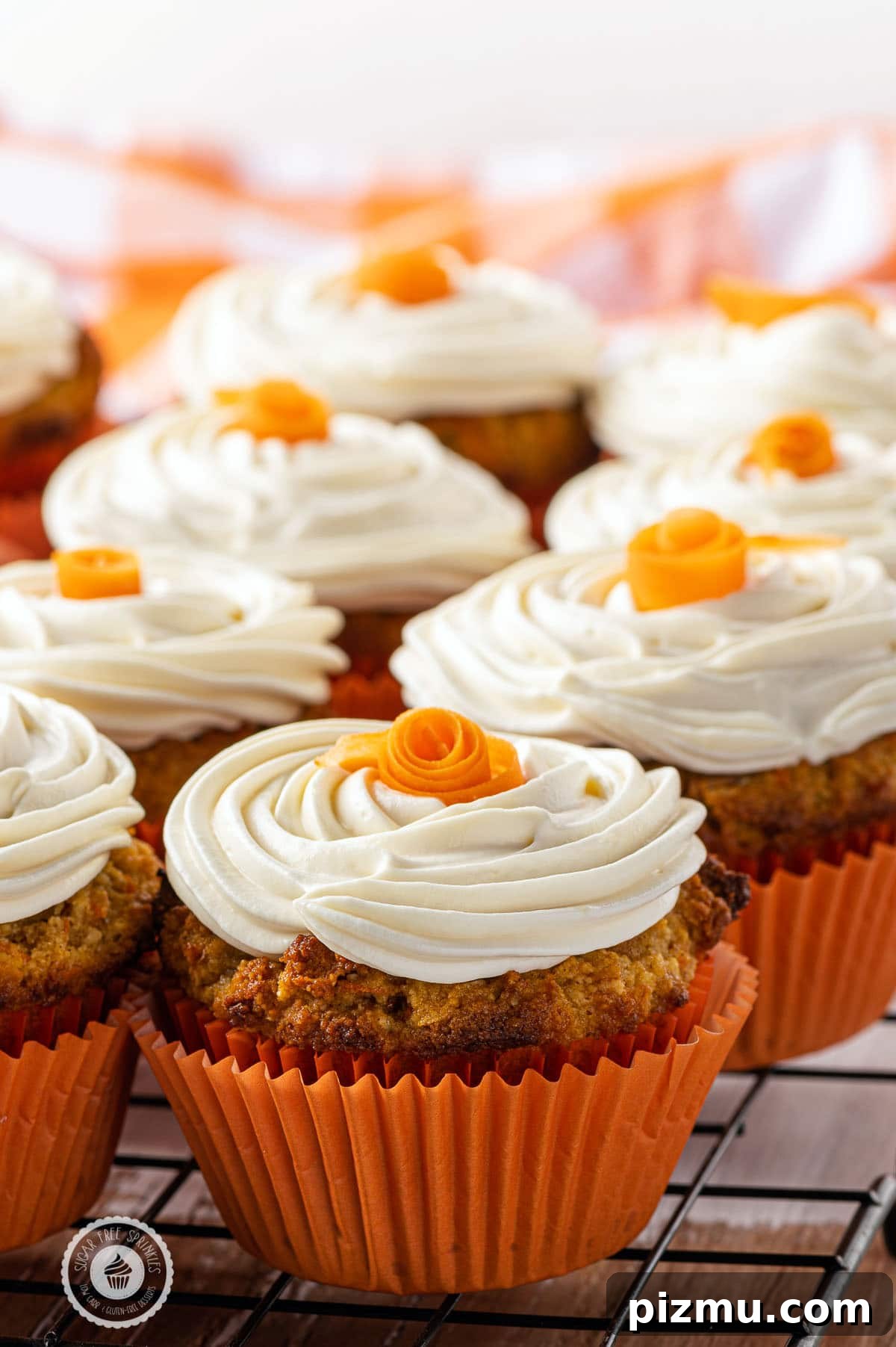 11 Keto Muffins for Quick Grab-and-Go Mornings 5 Keto carrot cake muffins with cream cheese frosting, a low-carb, gluten-free breakfast or dessert option for non-egg breakfast lovers. The image intended to show an example of keto muffin recipes you can make on a carb restricted diet.