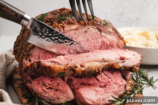 Bone-In Prime Rib Roast 9 A knife slicing a prime rib roast.