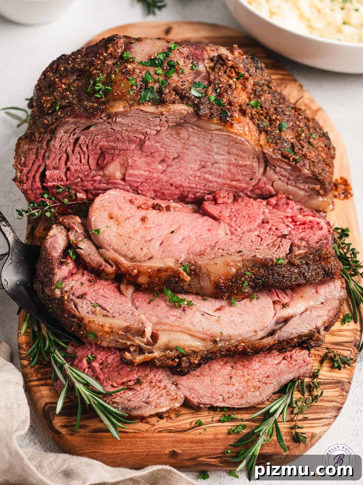 Bone-In Prime Rib Roast 3 Overhead view of a sliced roasted prime rib.