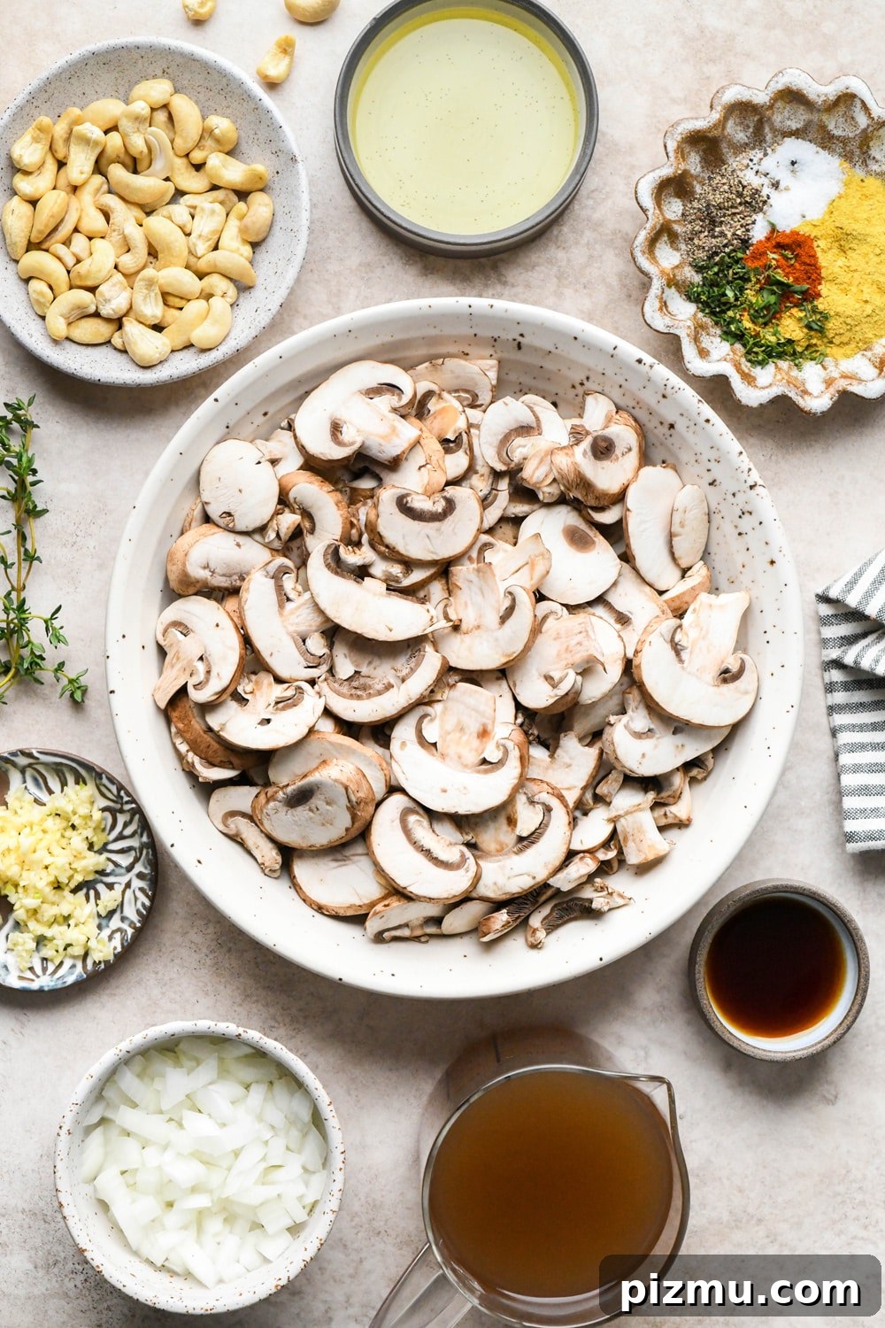 Creamy Gluten-Free Mushroom Gravy (Dairy-Free) 5 Gluten free mushroom gravy ingredients in various ceramics on a light brown background.