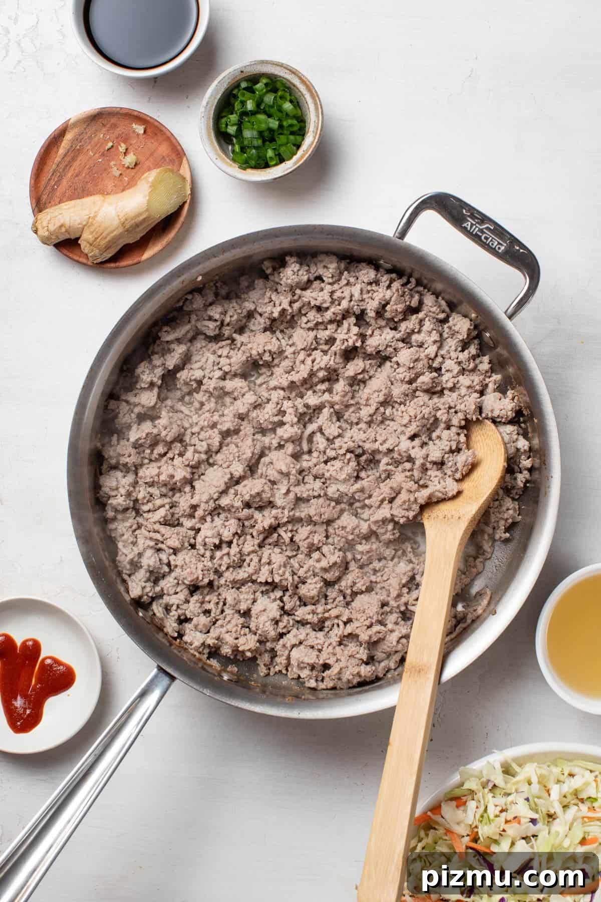 Ground Turkey Egg Roll Bowl with Soy-Ginger Sauce 4 A pan with ground turkey cooked through.