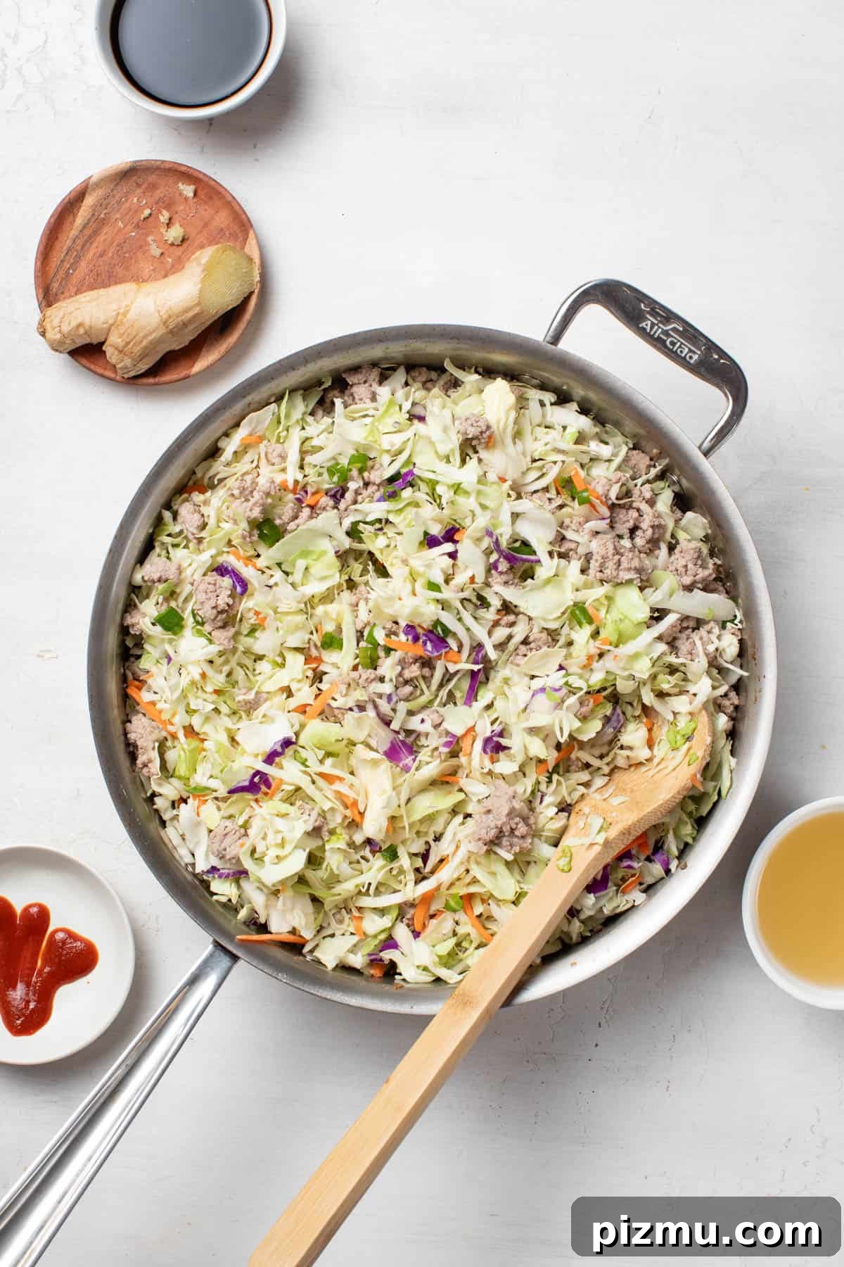 Ground Turkey Egg Roll Bowl with Soy-Ginger Sauce 6 Cooking down the coleslaw mix till it is softened.