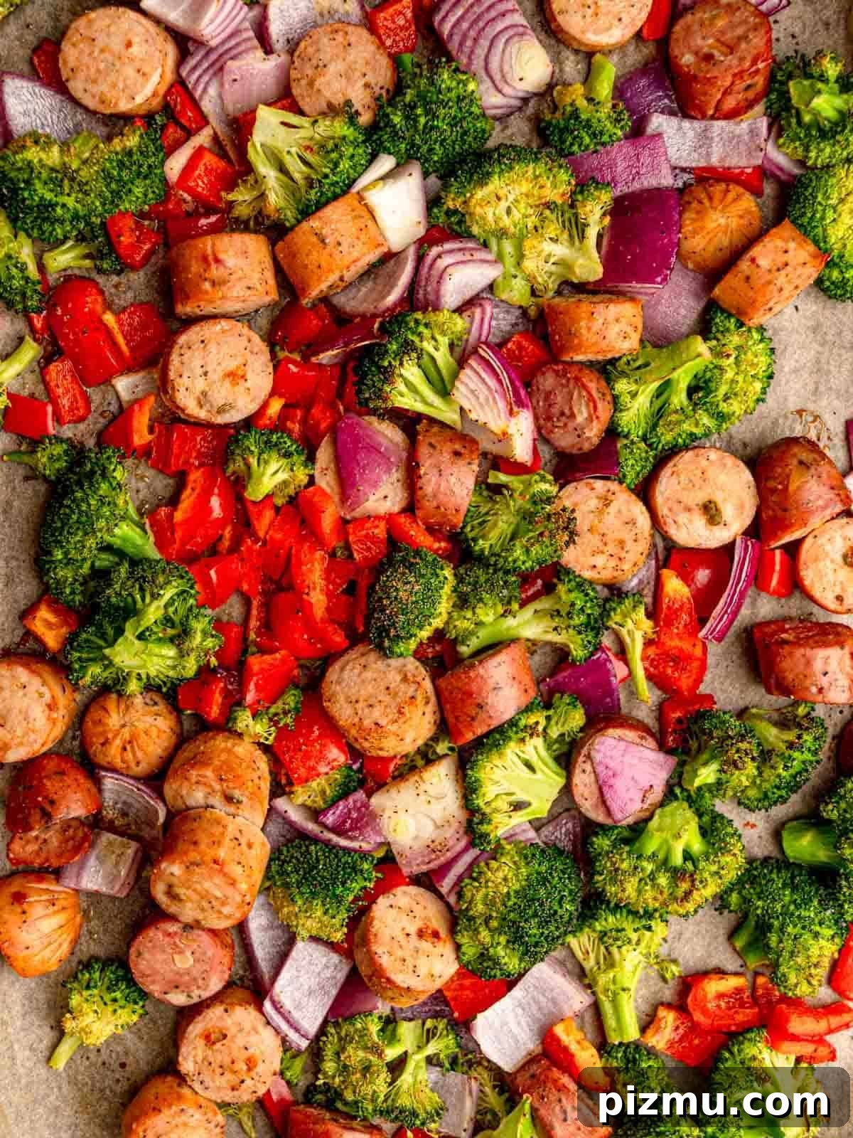 Sheet Pan Italian Sausage with Peppers and Broccoli Recipe 5 Chicken sausage on a sheet pan with vegetables.