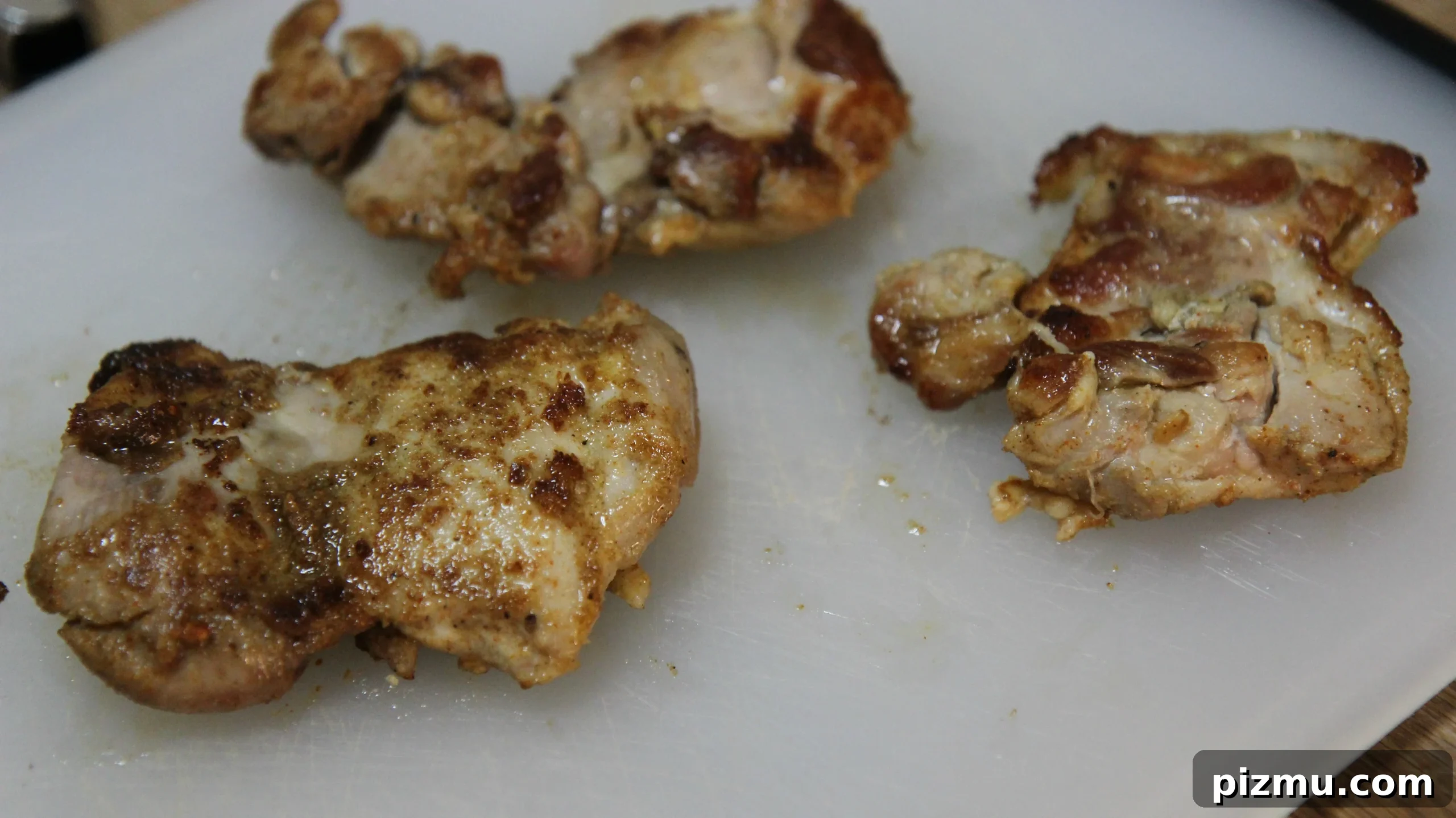 Where to Find NYC Halal Cart Chicken and Rice 4 perfectly seasoned chicken thighs.