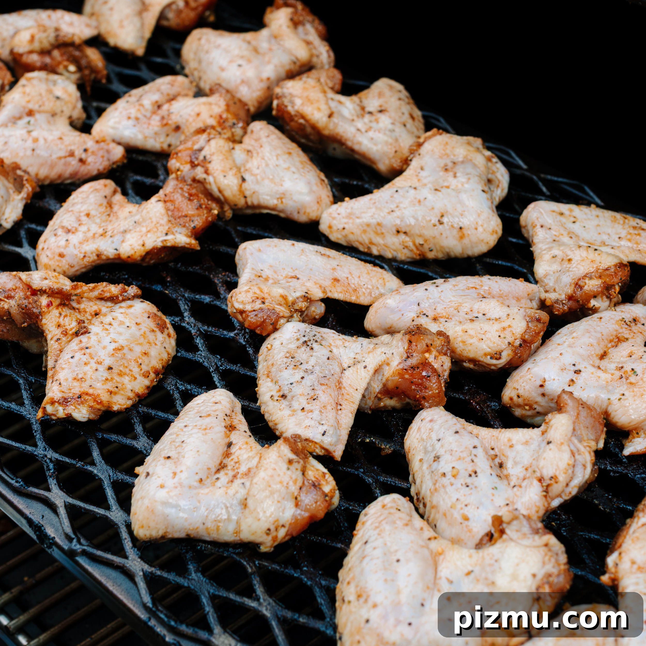 Buffaque Wings Recipe: Buffalo BBQ Chicken Wings 5 Raw chicken wings on a smoker.