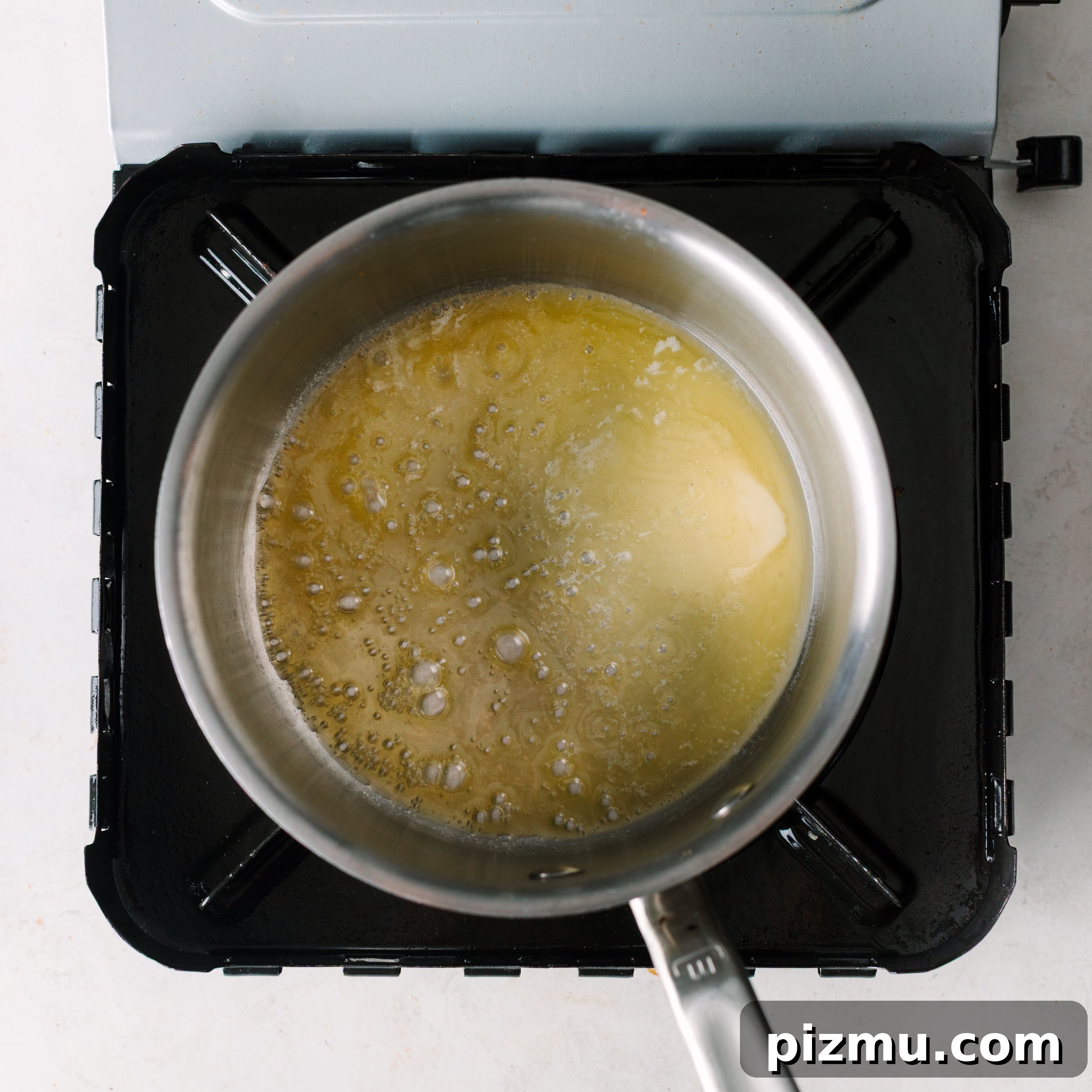 Buffaque Wings Recipe: Buffalo BBQ Chicken Wings 6 Cooking sauce in a saucepan.